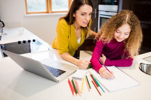 mother daughter helping with homework