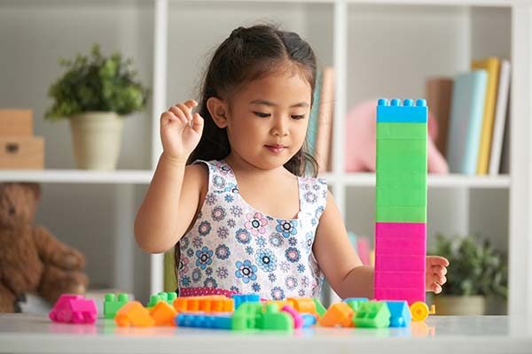 girl building tower