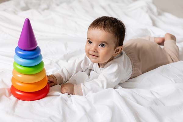 baby laying on blanket