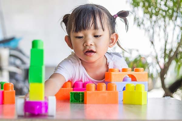 girl playing with blocks