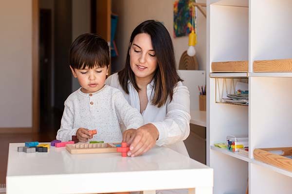 mother homeschooling her kid