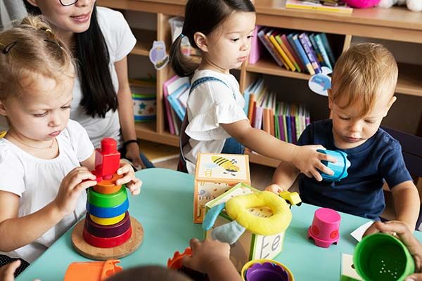 kids playing with teacher